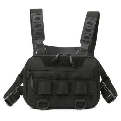 Front view of Rovix tactical EDC chest bag in all black with zip pocket, MOLLE straps, D-rings, and adjustable shoulder harness.
