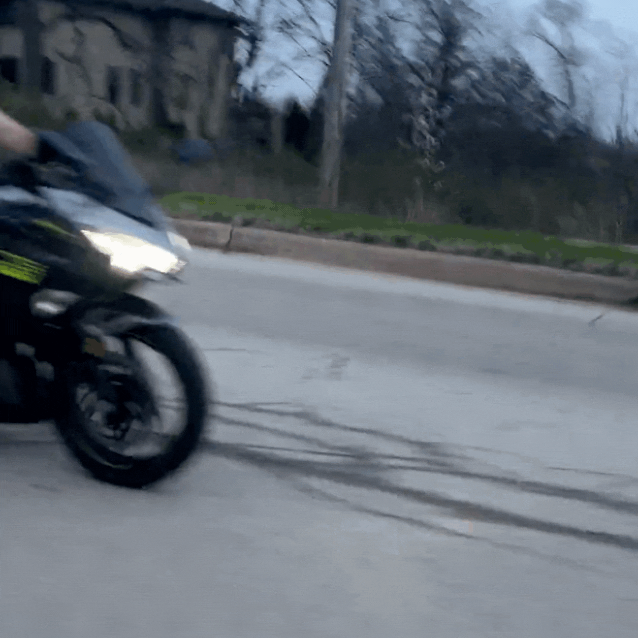 GIF of rider wearing tactical chest bag while riding a motorcycle, showcasing secure fit and on-the-go utility.